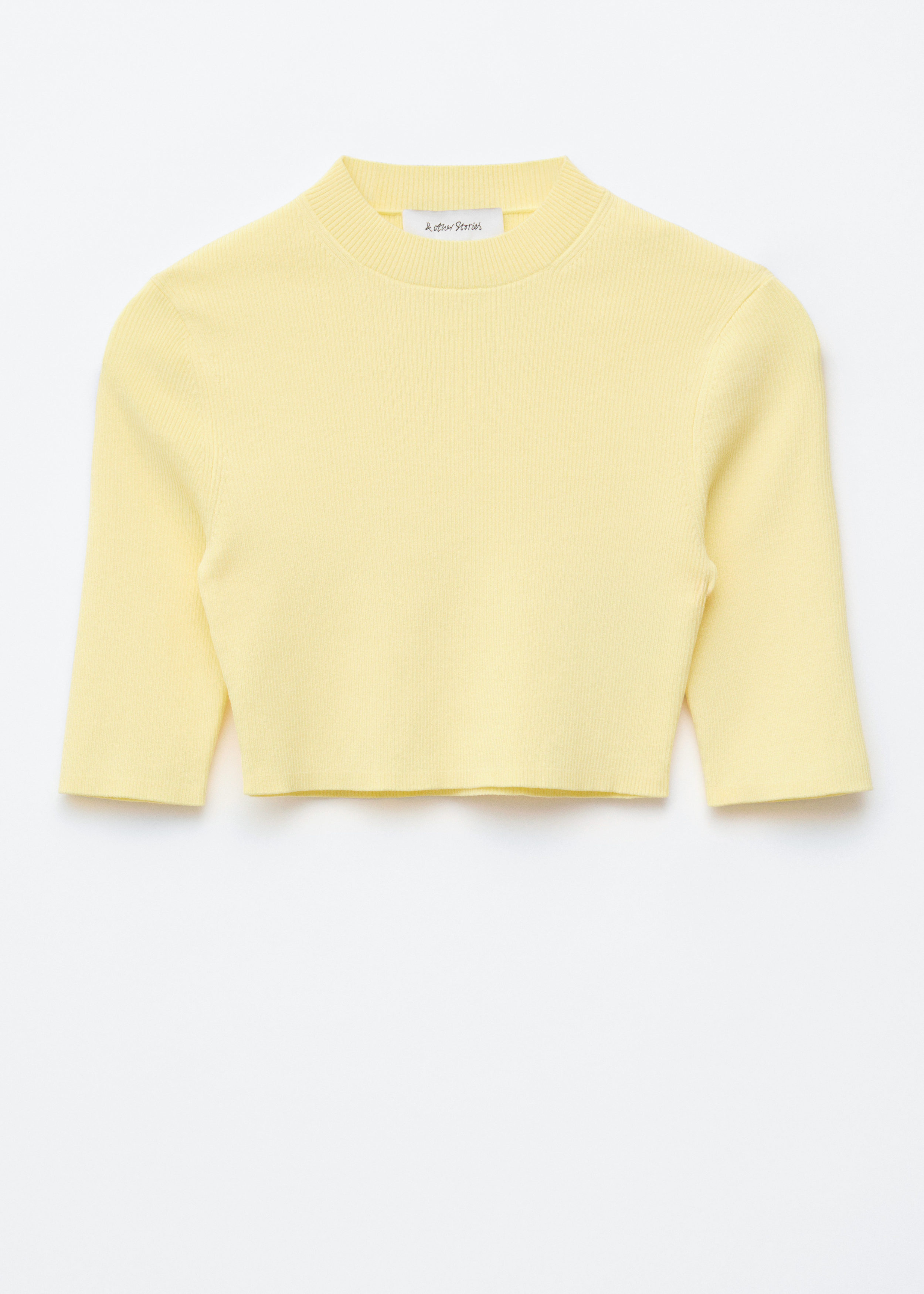 앤아더스토리즈 슬림 핏 크롭 티셔츠의 파스텔 옐로우컬러 Product입니다.