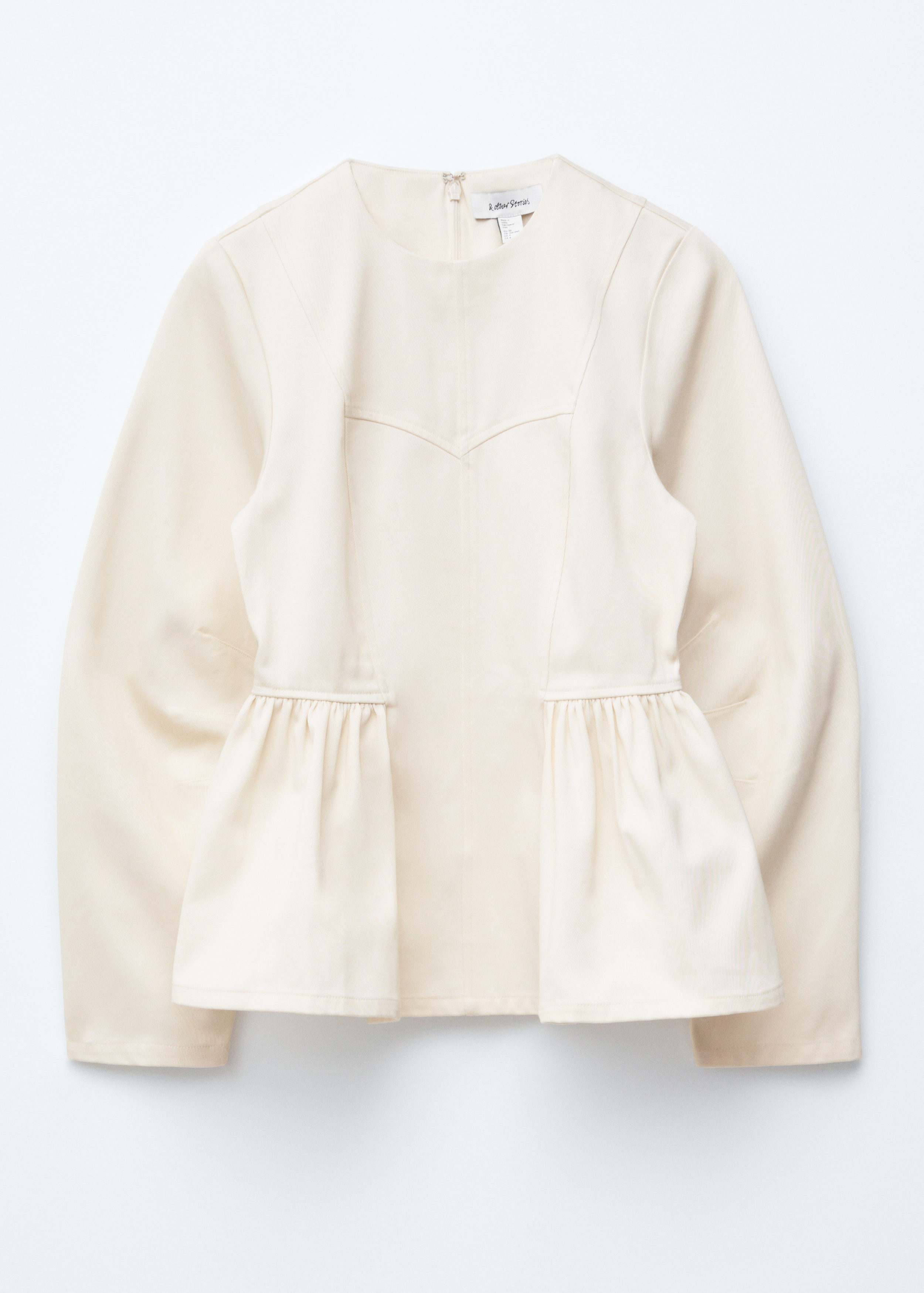 앤아더스토리즈 코튼 페플럼 탑의 크림컬러 Product입니다.