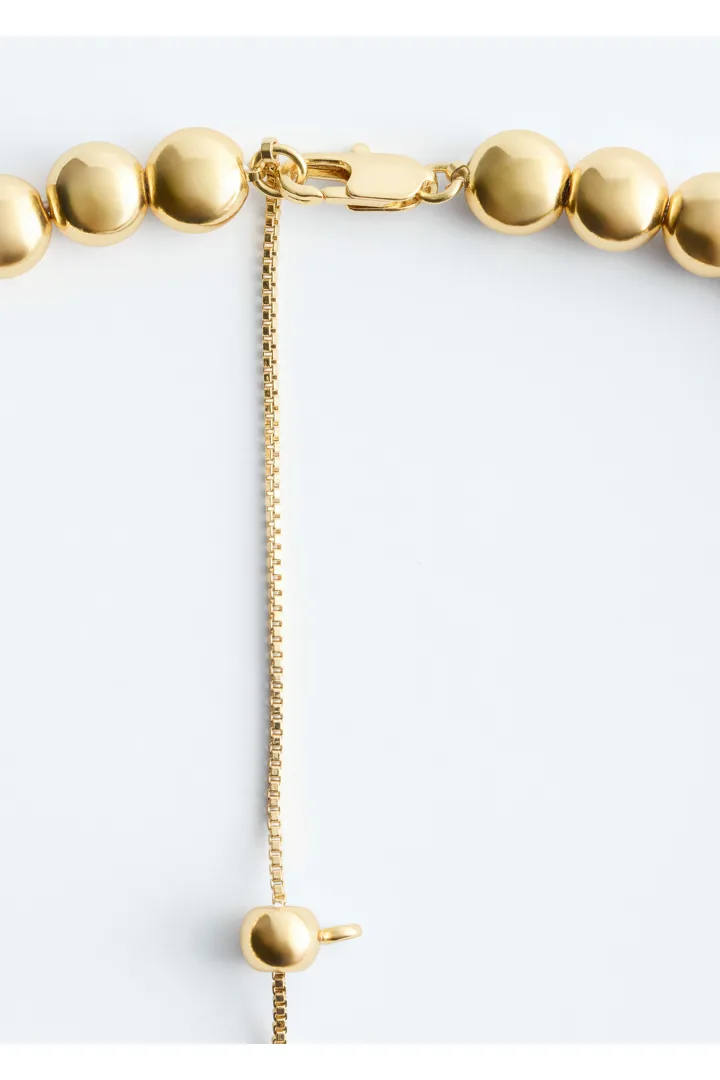 앤아더스토리즈 쇼트 비즈 네크리스의 골드컬러 Product입니다.