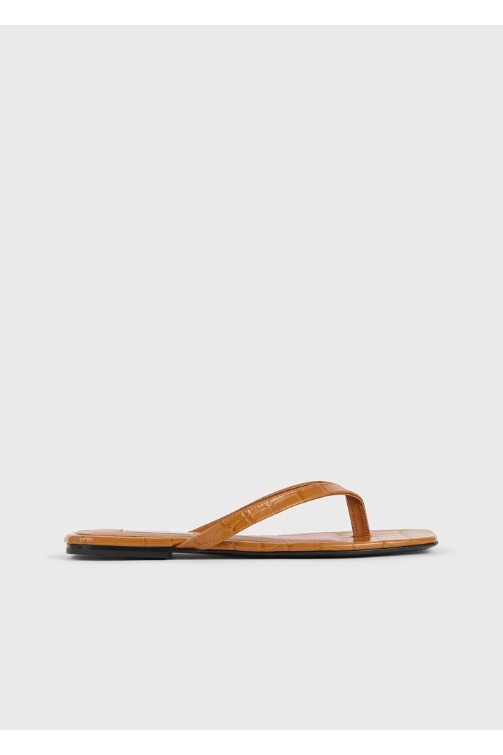 TOTEME 크로커 엠보스드 플립 플랍 탠저린의 탠저린컬러 0번쨰 이미지입니다.