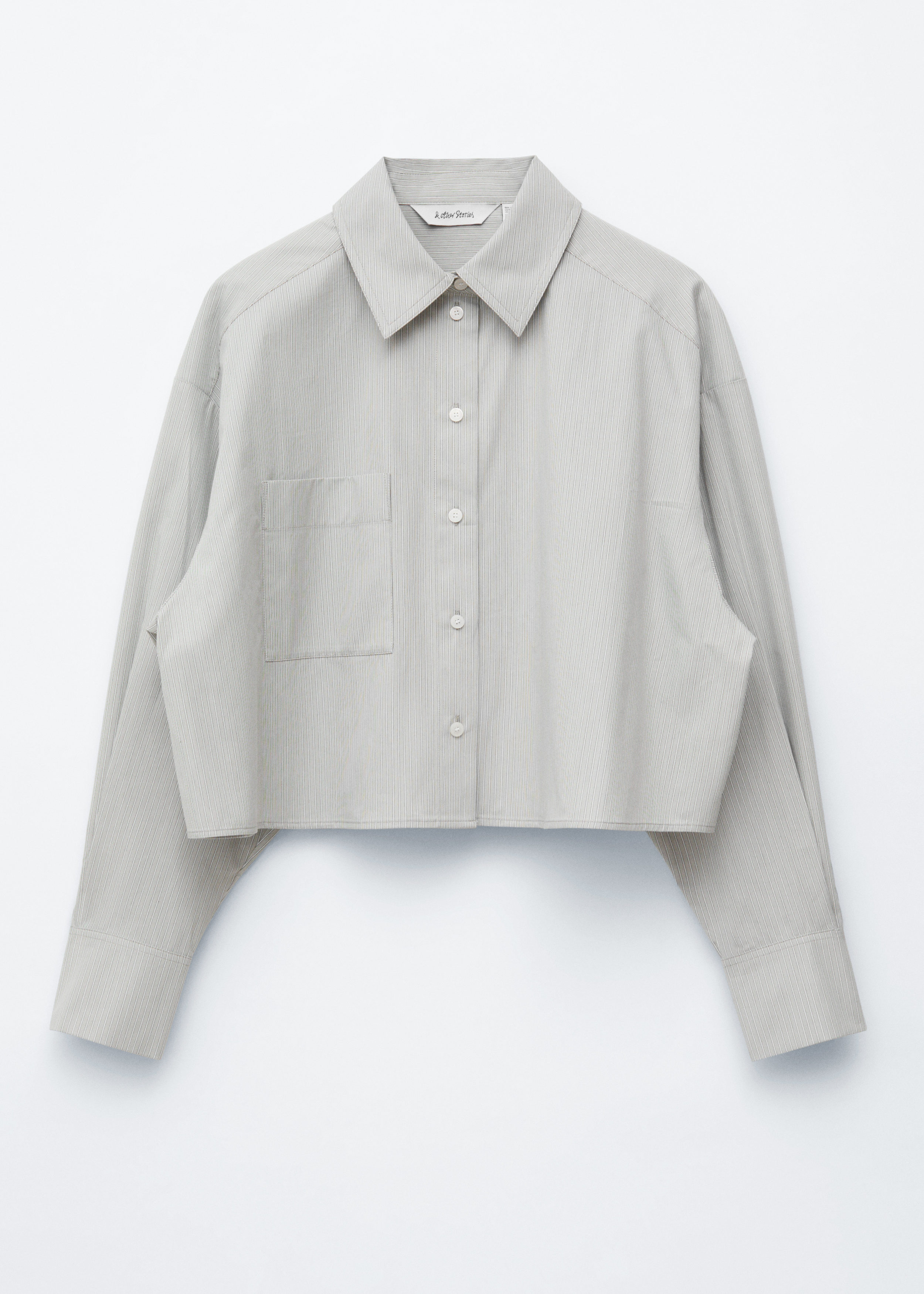 앤아더스토리즈 크롭 오버사이즈 코튼 셔츠의 베이지-블루 스트라이프컬러 Product입니다.