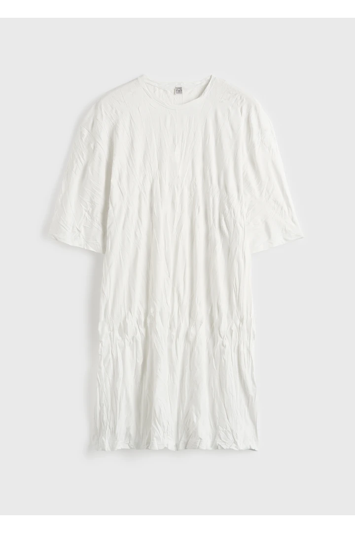 TOTEME 릴랙스드 티 드레스 오프 화이트의 오프 화이트컬러 4번쨰 이미지입니다.