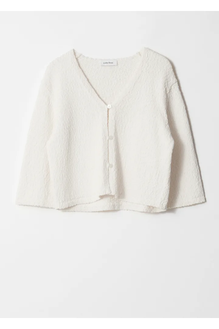 앤아더스토리즈 니트 쇼트 슬리브 가디건의 화이트컬러 Product입니다.