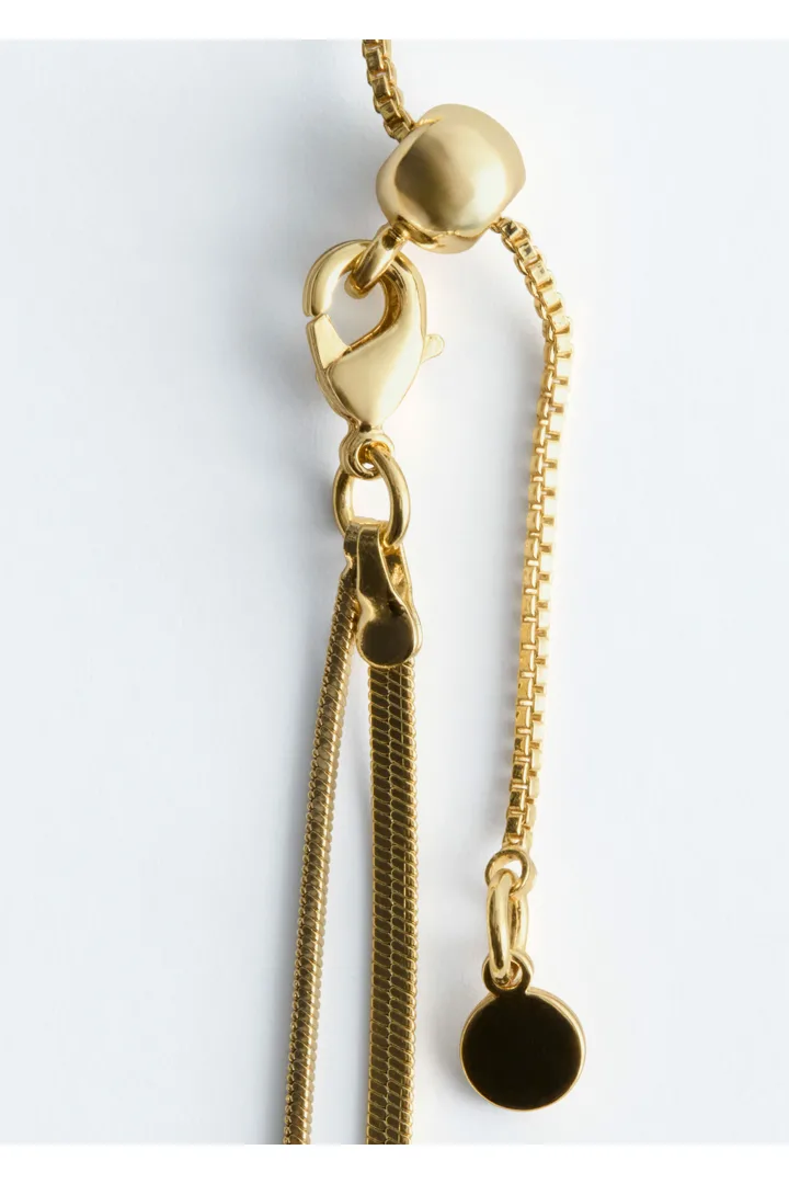 앤아더스토리즈 매듭 디테일 래리어트 네크리스의 골드컬러 Product입니다.