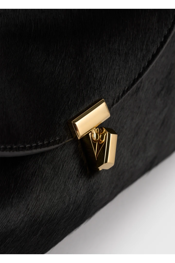 TOTEME 미니 티-락 포니 헤어 클러치 블랙의 블랙컬러 1번쨰 이미지입니다.